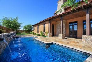 A pool with water feature in Arcadia at Silverleaf