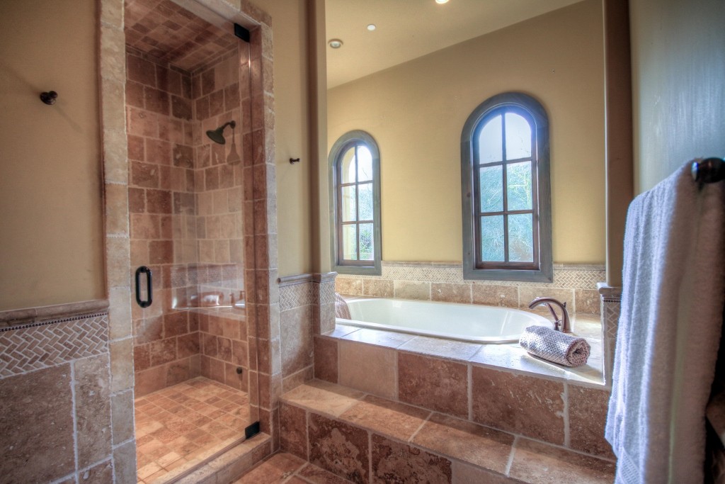 Master bathroom with travertine finishes