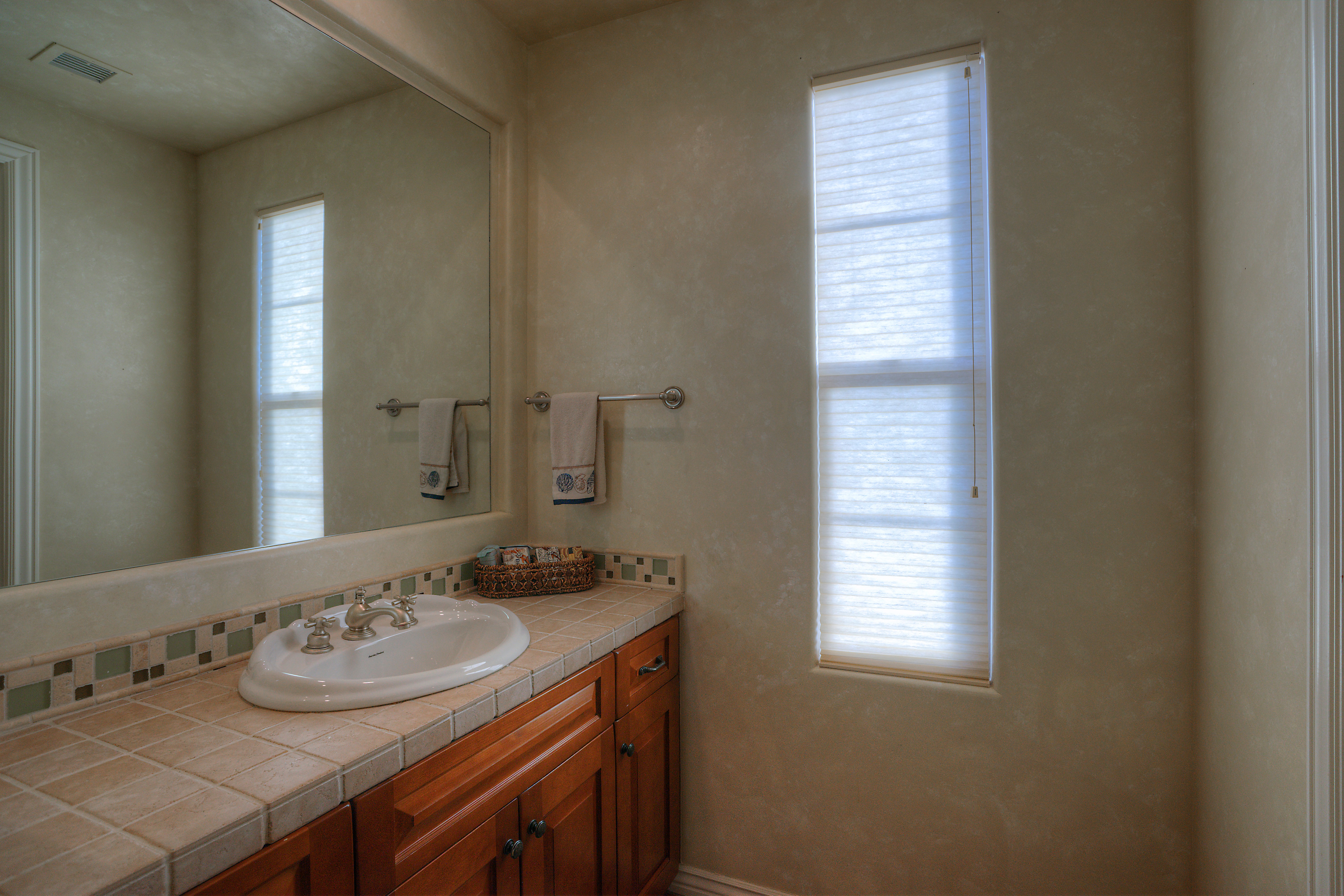 Vanity in guest suite at this Scottsdale home for sale in DC Ranch located at 19829 N 97th Pl Scottsdale, AZ 85255 listed by Don Matheson at The Matheson Team