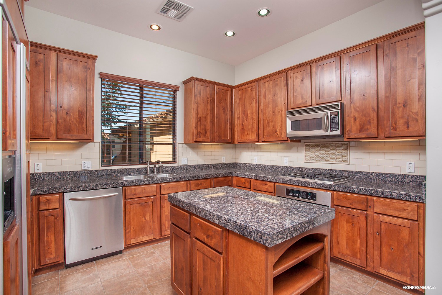 Subway tile backsplash at this Scottsdale townhome for sale in Market Street at DC Ranch located at 20704 N 90th Pl #1005 Scottsdale, AZ 85255 listed by Don Matheson at The Matheson Team