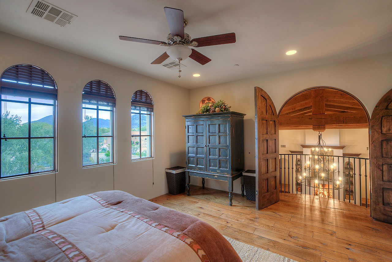 Guest bedroom with balcony at this Scottsdale home for sale located at 9290 E Thompson Peak Pkwy #455 Scottsdale, AZ 85255 listed by Don Matheson at The Matheson Team