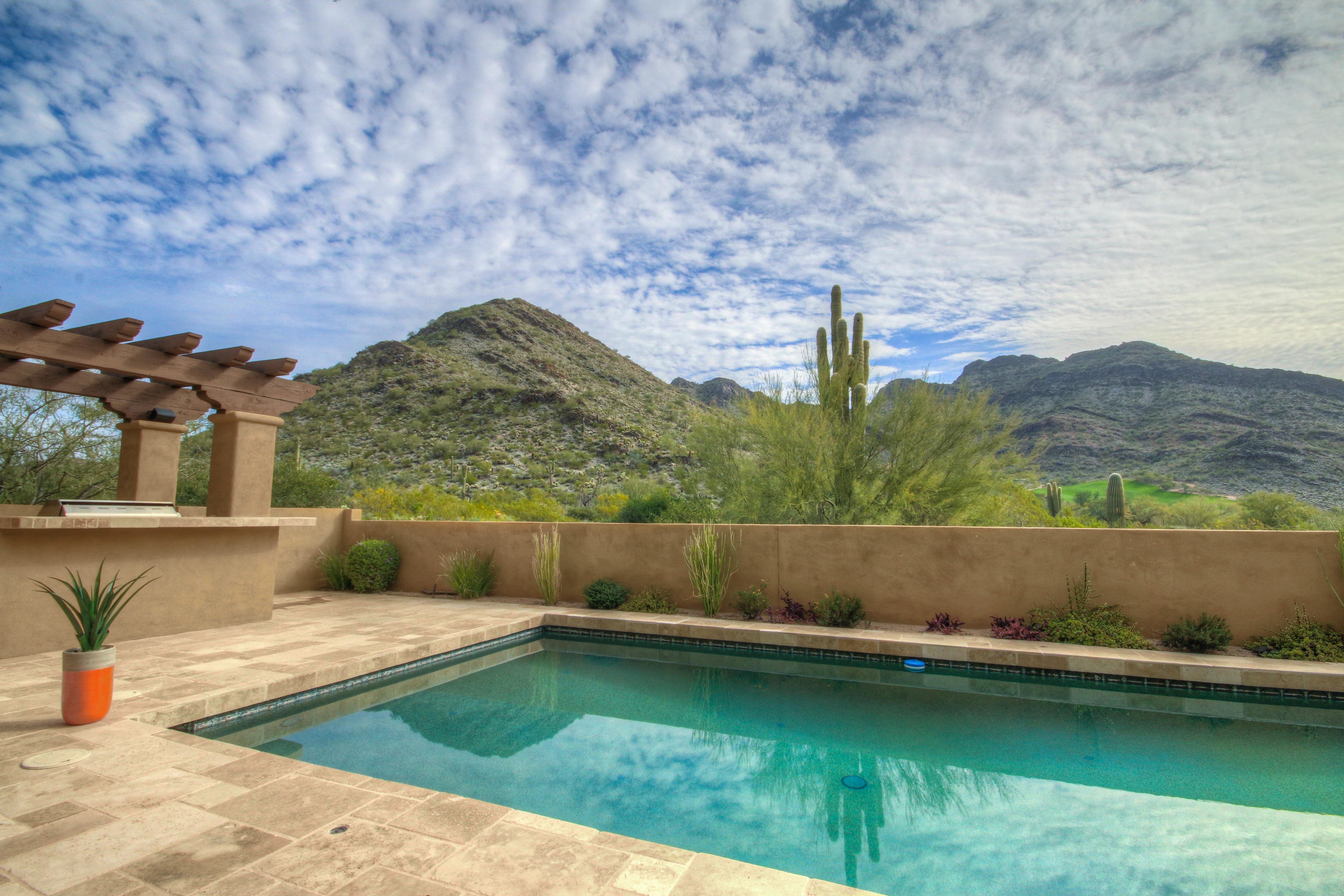 Sparkling pool and mountain views in this DC Ranch home for sale located at 9820 E Thompson Peak Pkwy #620, Scottsdale, AZ 85255 listed by Don Matheson