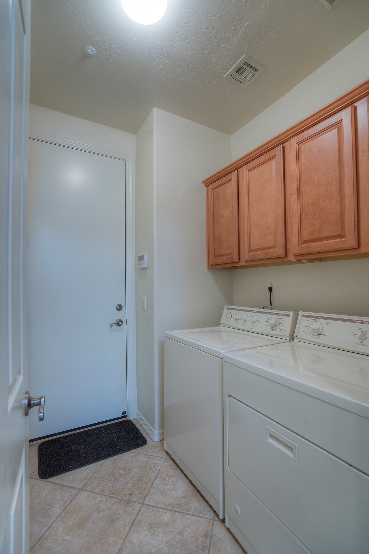 Laundry room with cabinets at this Scottsdale home for sale located in DC Ranch at 9270 E Thompson Peak Pwky #320 Scottsdale, AZ 85255 listed by Don Matheson at The Matheson Team