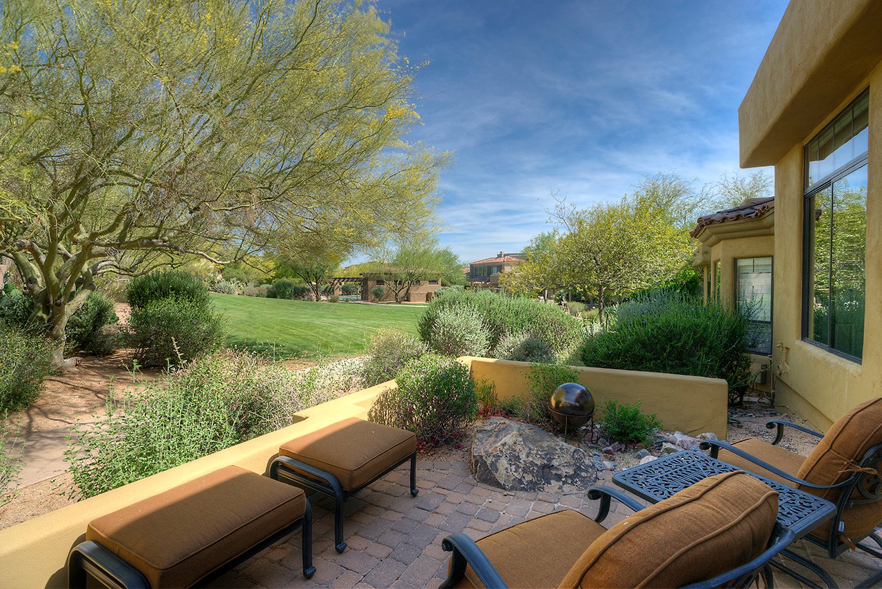 Patio looks onto grassy area