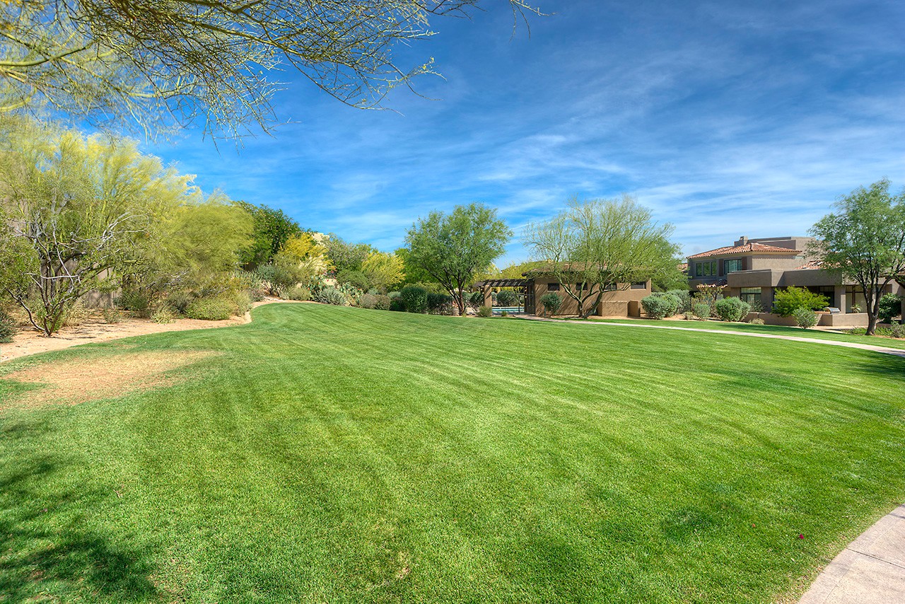 Large grassy area at this Scottsdale home for sale located in DC Ranch at 9270 E Thompson Peak Pwky #320 Scottsdale, AZ 85255 listed by Don Matheson at The Matheson Team